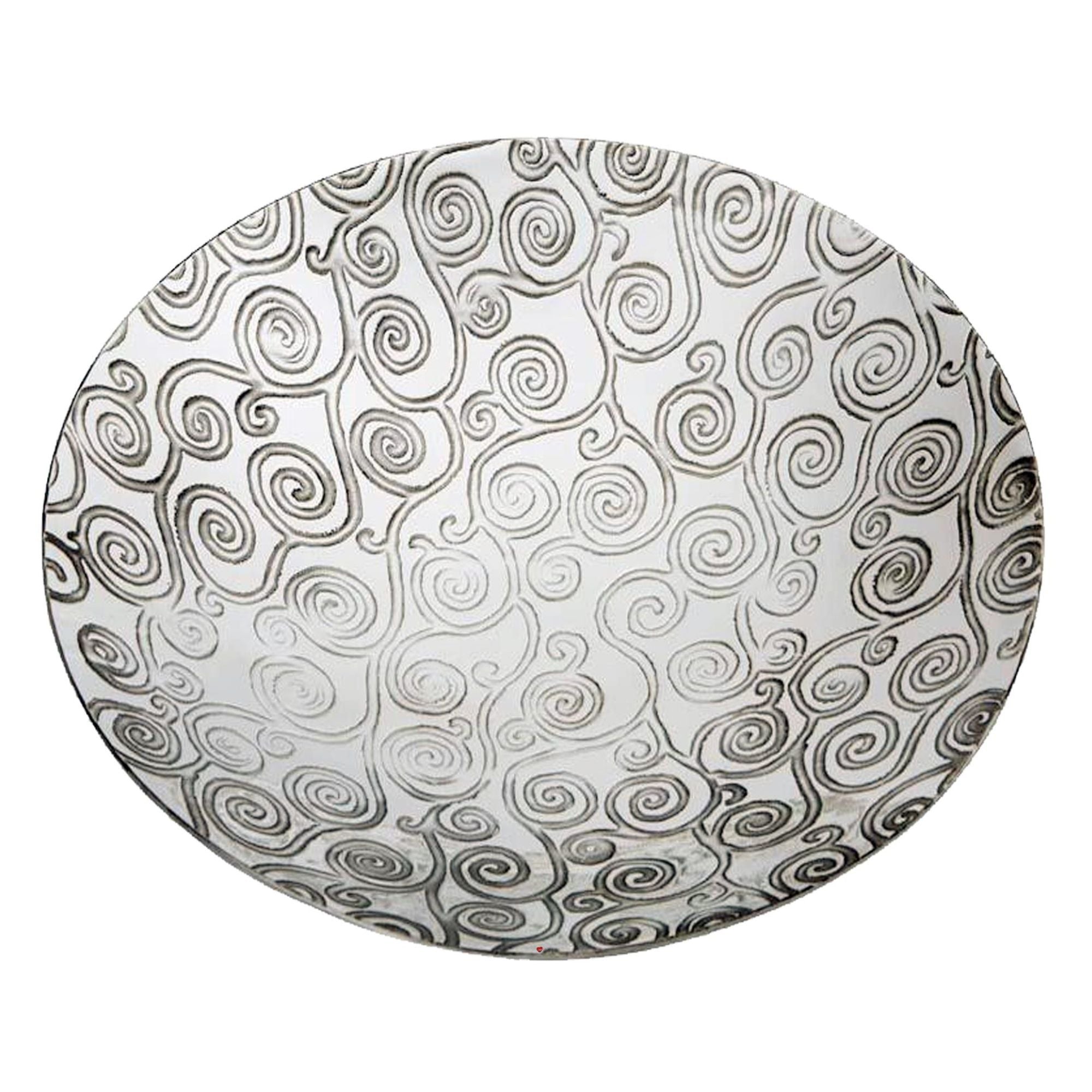 Round plate with black and white spiral pattern on a white background