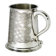 Silver tankard with Celtic knot design on a white background