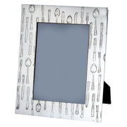 Decorative picture frame with cutlery pattern on a white background