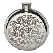 Round silver flask with skull design on a white background