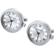 Pair of silver cufflinks with clock face design on a white background