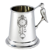Silver tankard with bird handle on a white background