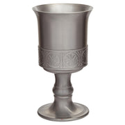 Silver goblet with intricate designs on a white background