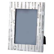 Decorative photo frame with kitchen utensil pattern on a white background