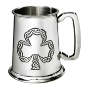 Silver tankard with a shamrock design on a white background