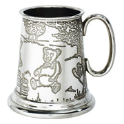 Silver tankard with engraved teddy bear design on a white background