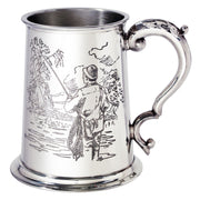 Silver tankard with engraved design on a white background