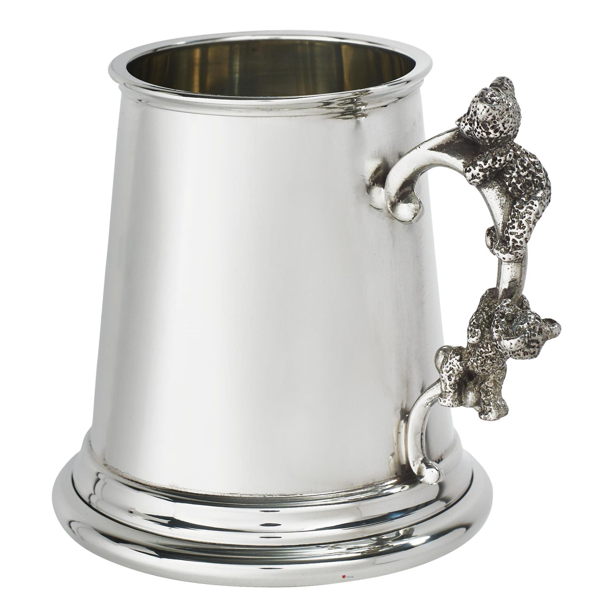 Silver tankard with a decorative handle on a white background