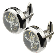 Silver cufflinks with mechanical design on a white background