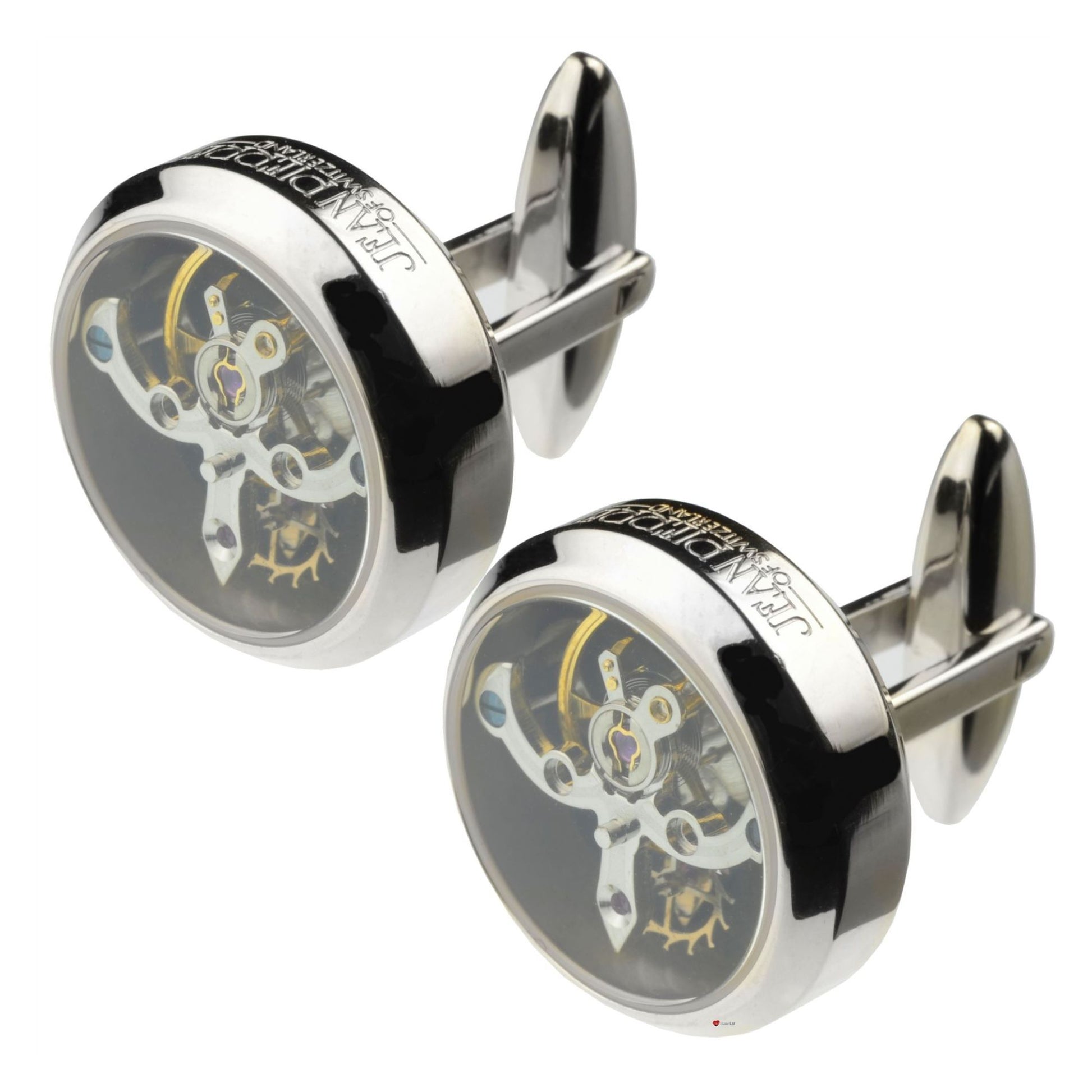 Silver cufflinks with mechanical design on a white background