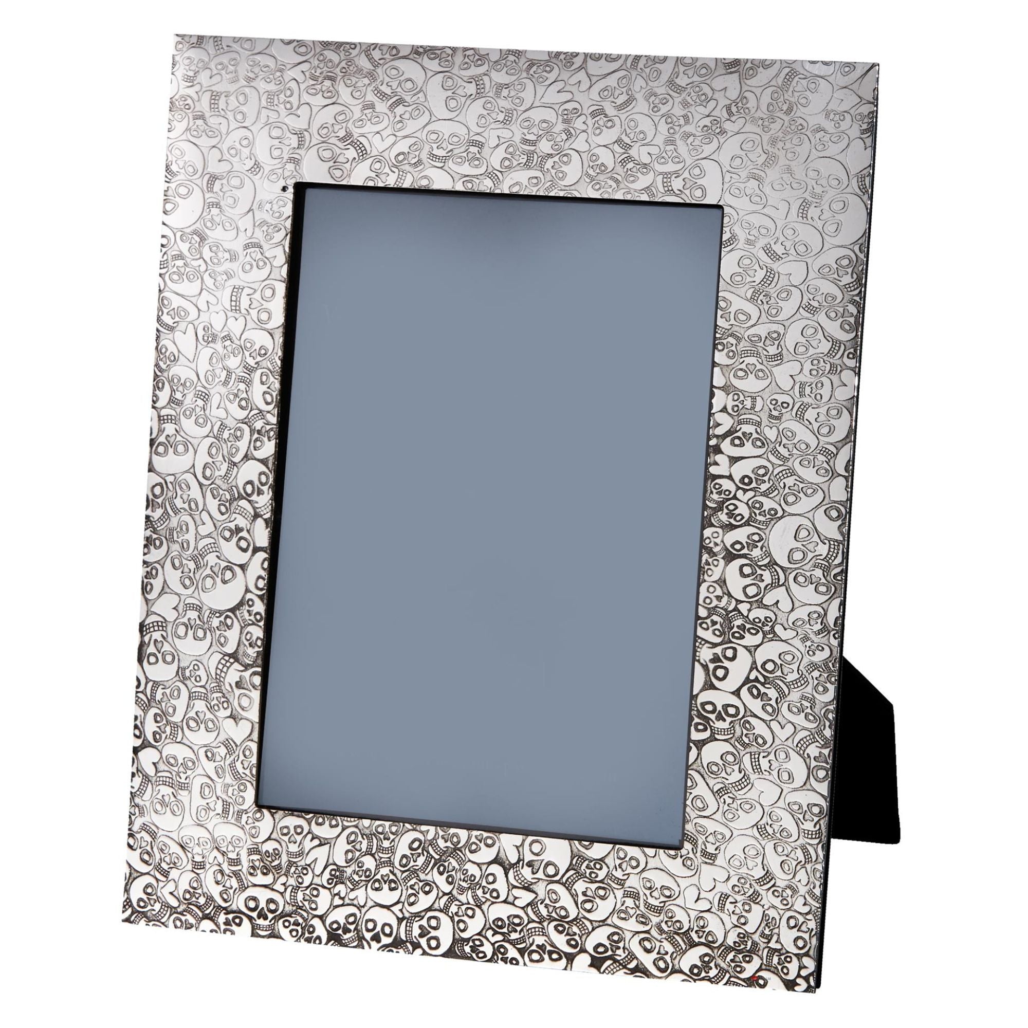 Decorative silver photo frame with intricate patterns on a white background