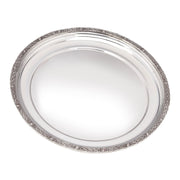 Silver decorative tray with intricate border on a white background
