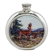 Round silver flask with deer design on a white background
