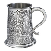 Metal mug with skull pattern on a white background