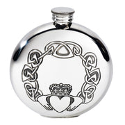 Silver flask with Claddagh design on a white background