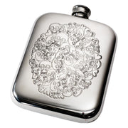 Silver flask with skull design on a white background