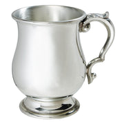 Silver mug with a handle on a white background