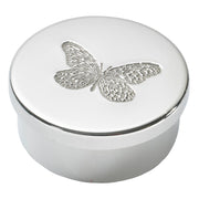 Round white box with a silver butterfly design on the lid against a white background