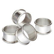 Set of four silver metal rings on a white background