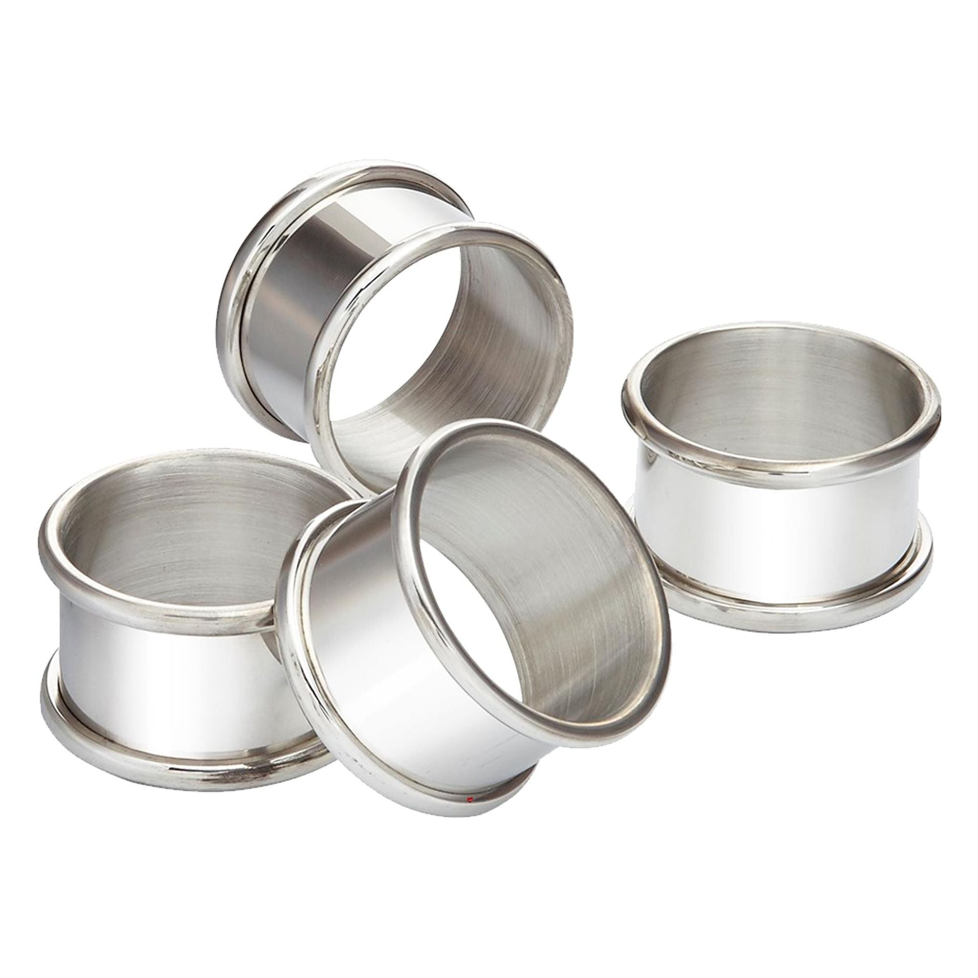 Set of four silver metal rings on a white background