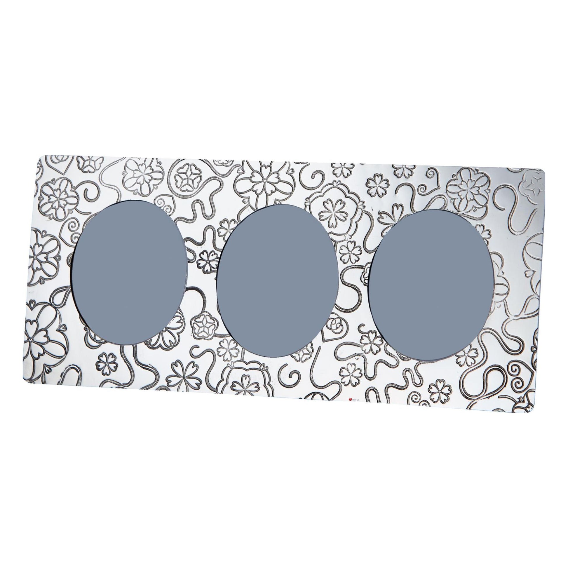 Three pairs of sunglasses with gray lenses on a decorative box with floral patterns.