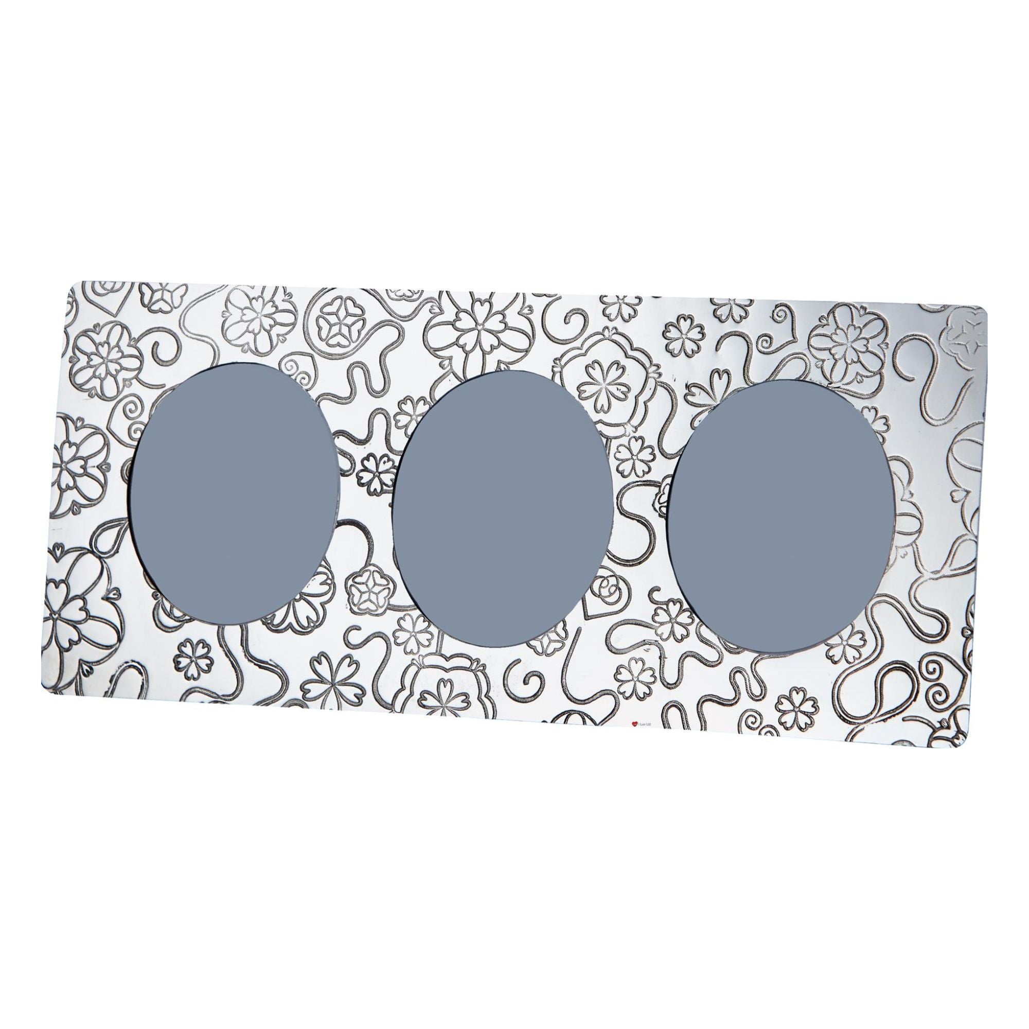 Three pairs of sunglasses with gray lenses on a decorative box with floral patterns.