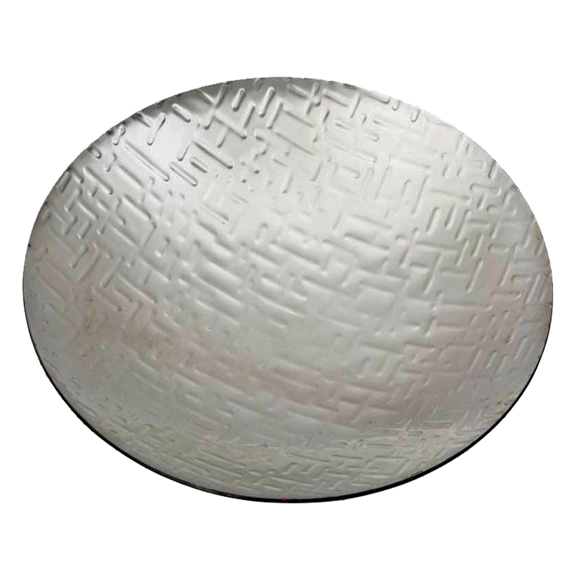 Round metallic object with textured surface on a white background