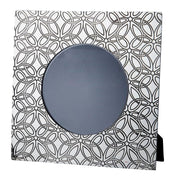 Decorative mirror with geometric black and white pattern on a white background