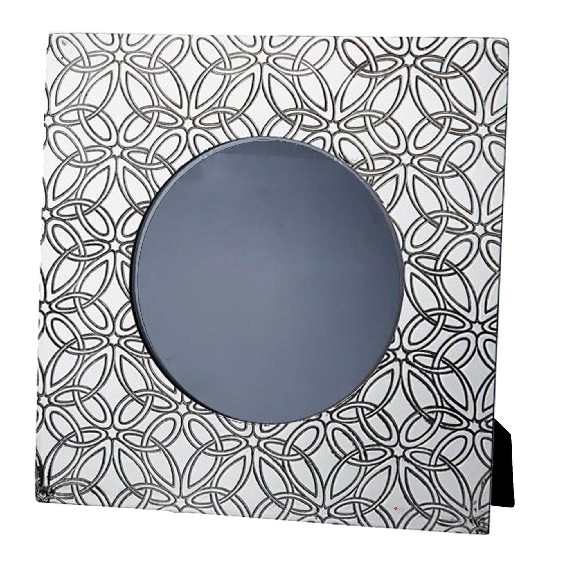 Decorative mirror with geometric black and white pattern on a white background