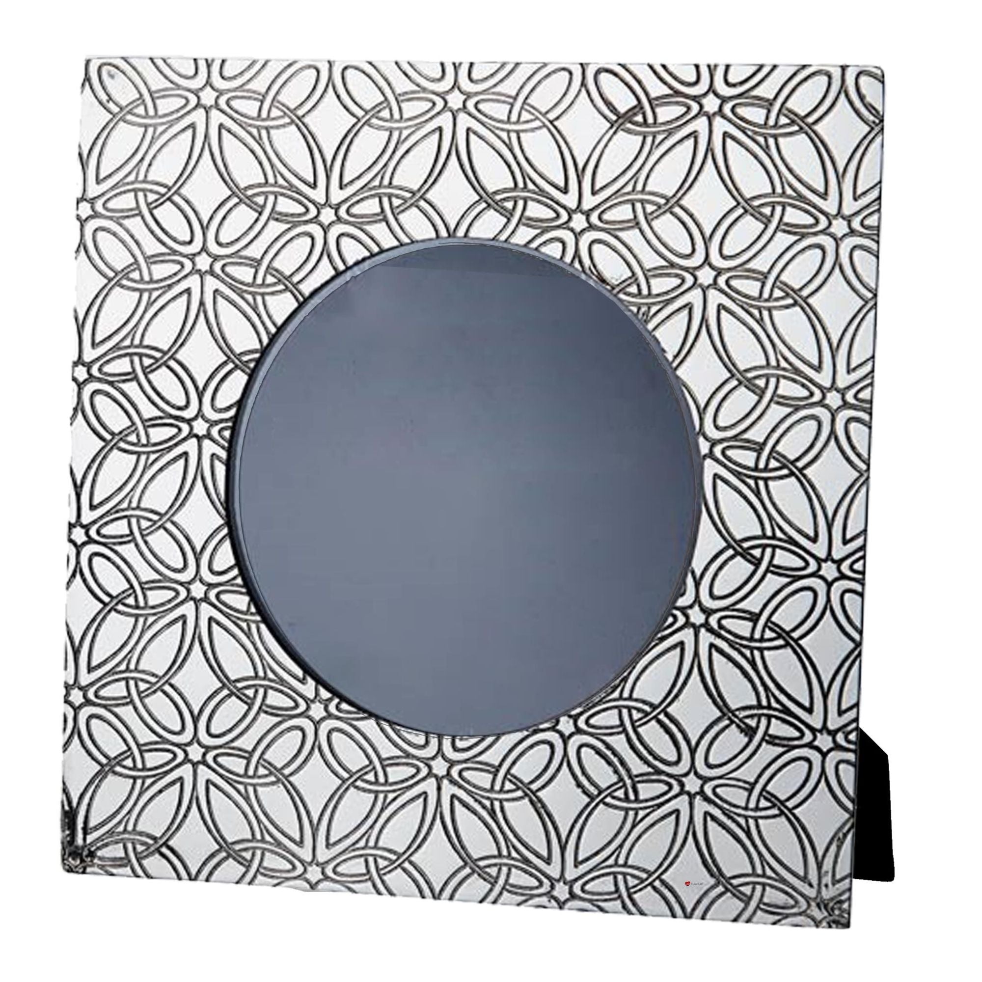 Decorative mirror with geometric black and white pattern on a white background