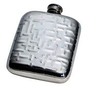 Silver flask with a textured surface on a white background