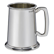 Silver tankard with a handle on a white background