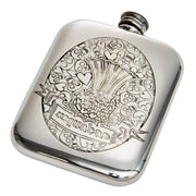 Silver hip flask with intricate design on a white background