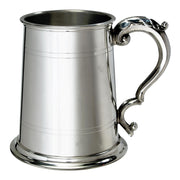 Silver tankard with decorative handle on a white background