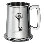 Silver tankard with a key design on a white background