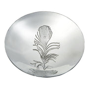 Silver dish with engraved feather design on a white background