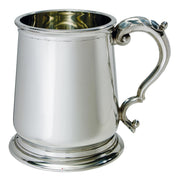 Silver tankard with a decorative handle on a white background