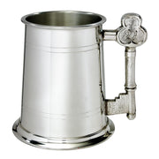 Silver tankard with decorative handle on a white background