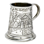Silver tankard with engraved scenes on a white background
