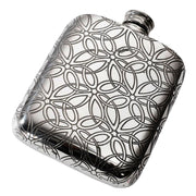 Silver hip flask with intricate pattern on a white background