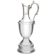 Silver pitcher on a white background