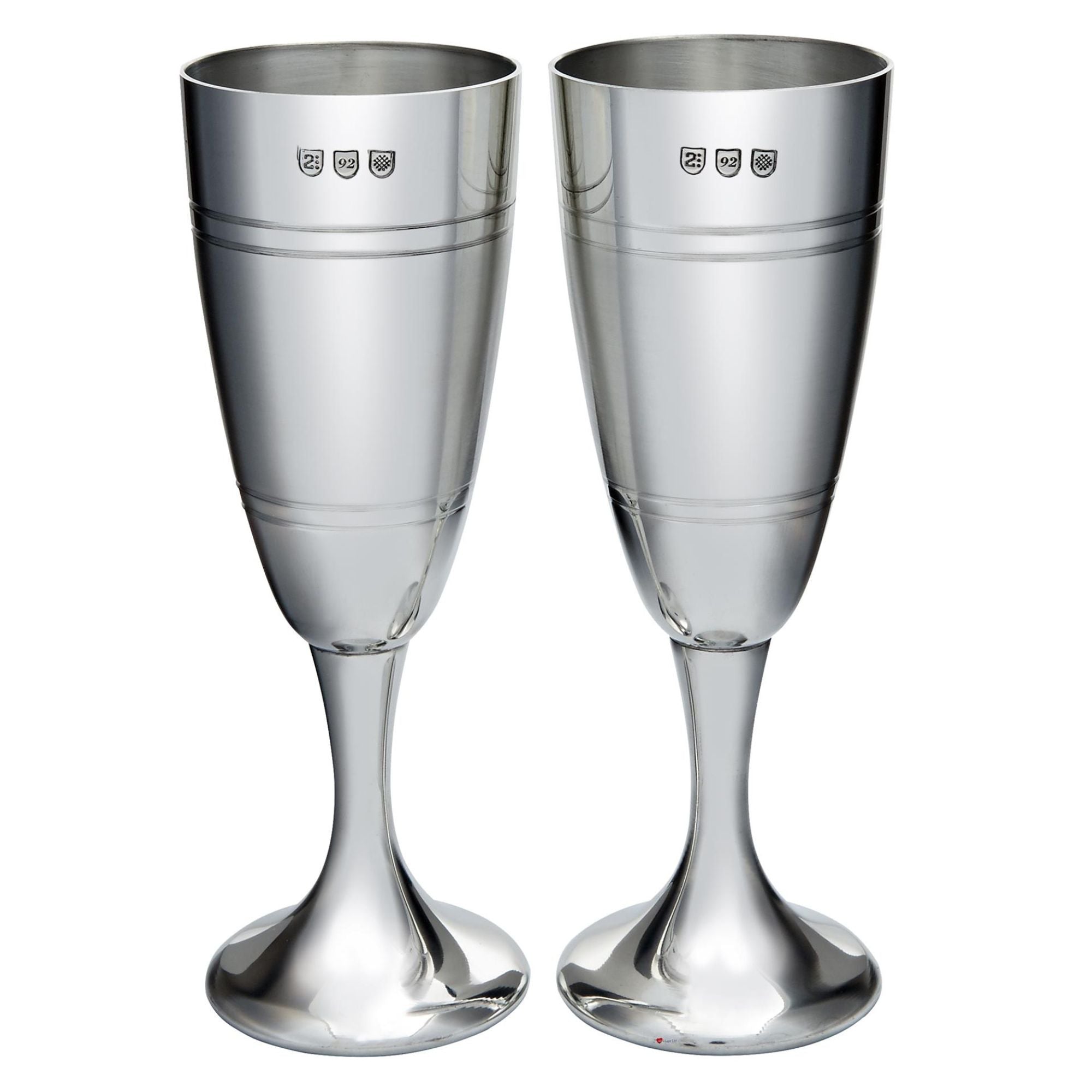 Two silver champagne flutes on a white background