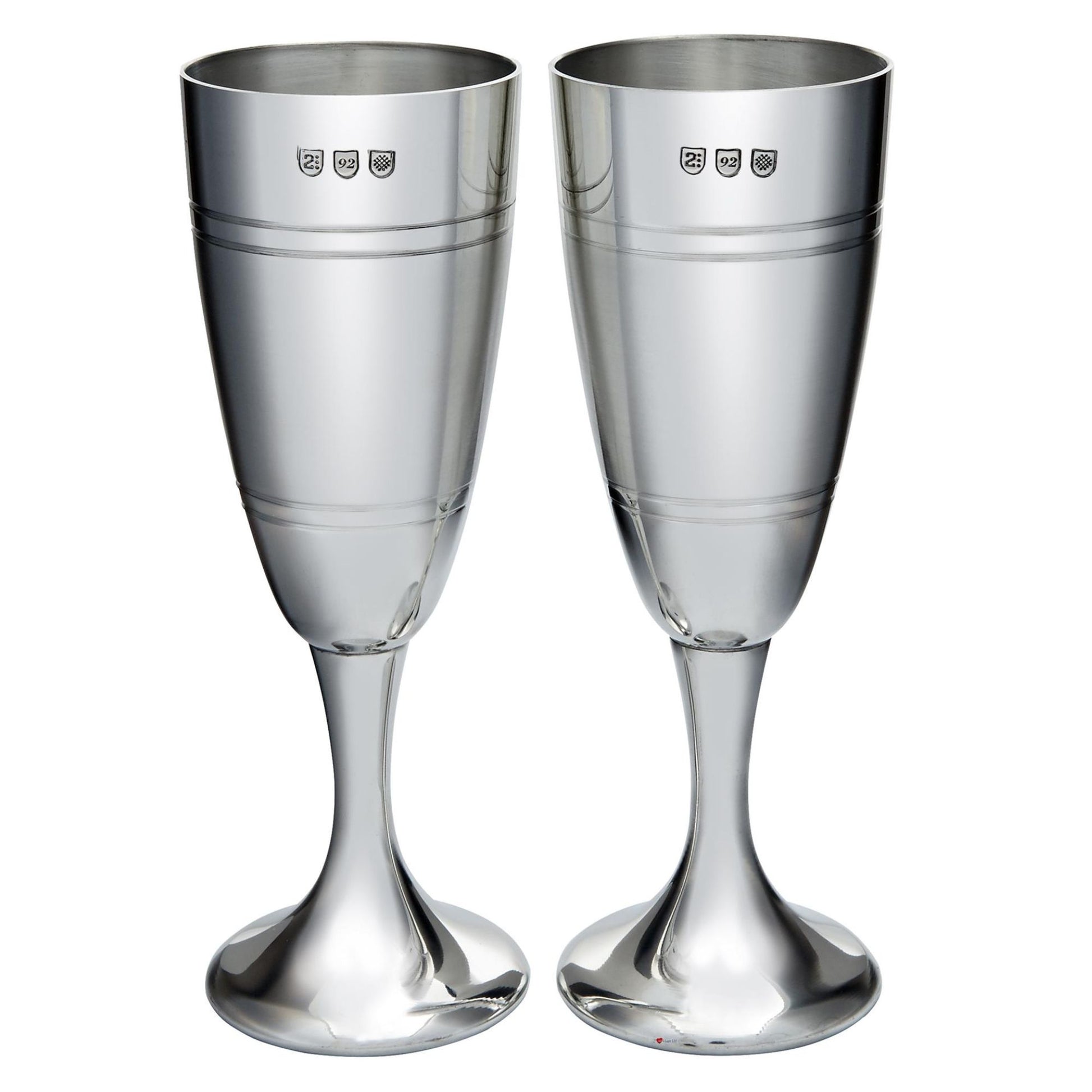Two silver champagne flutes on a white background