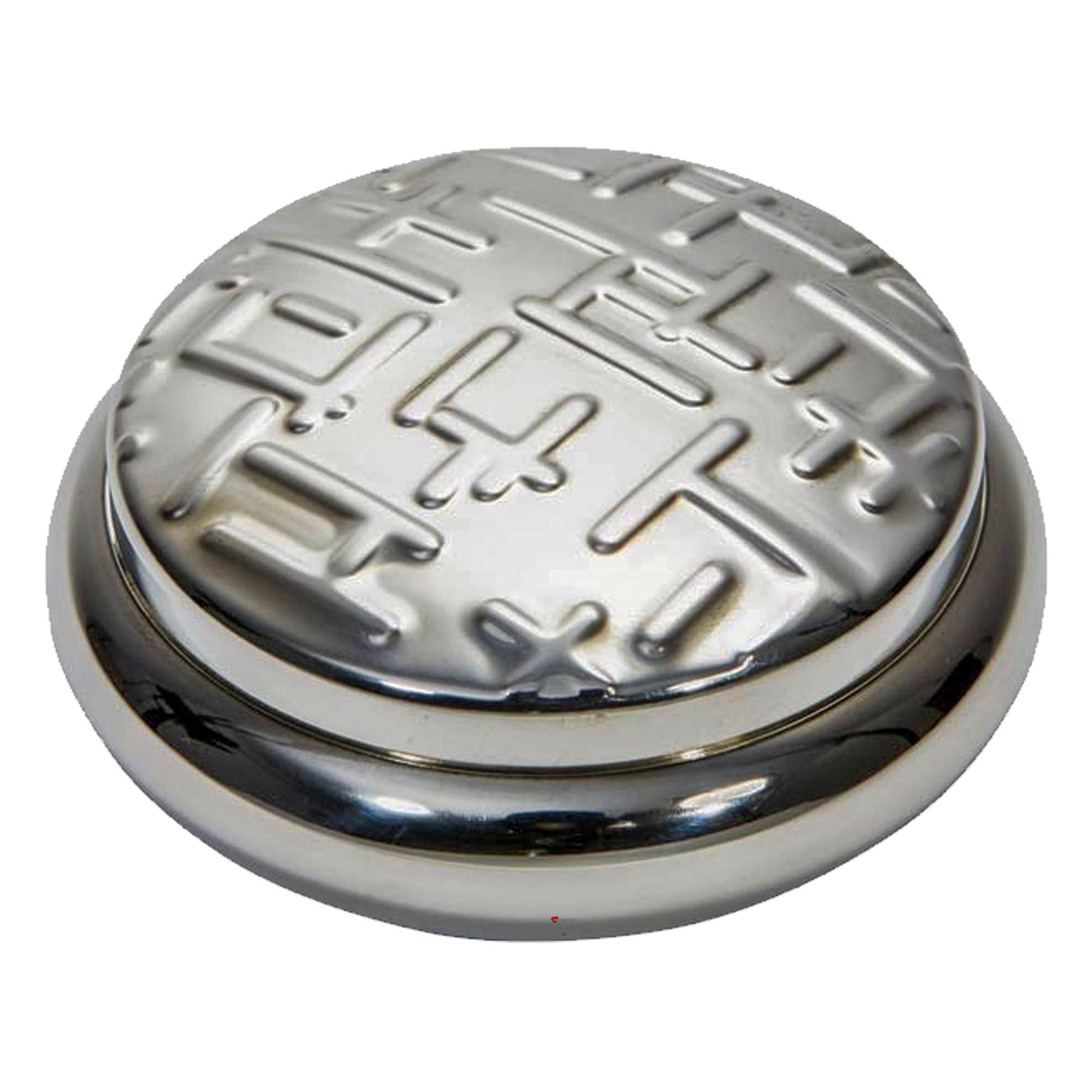 Round metallic object with intricate design on a white background