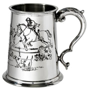 Silver tankard with hunting scene engraving on a white background
