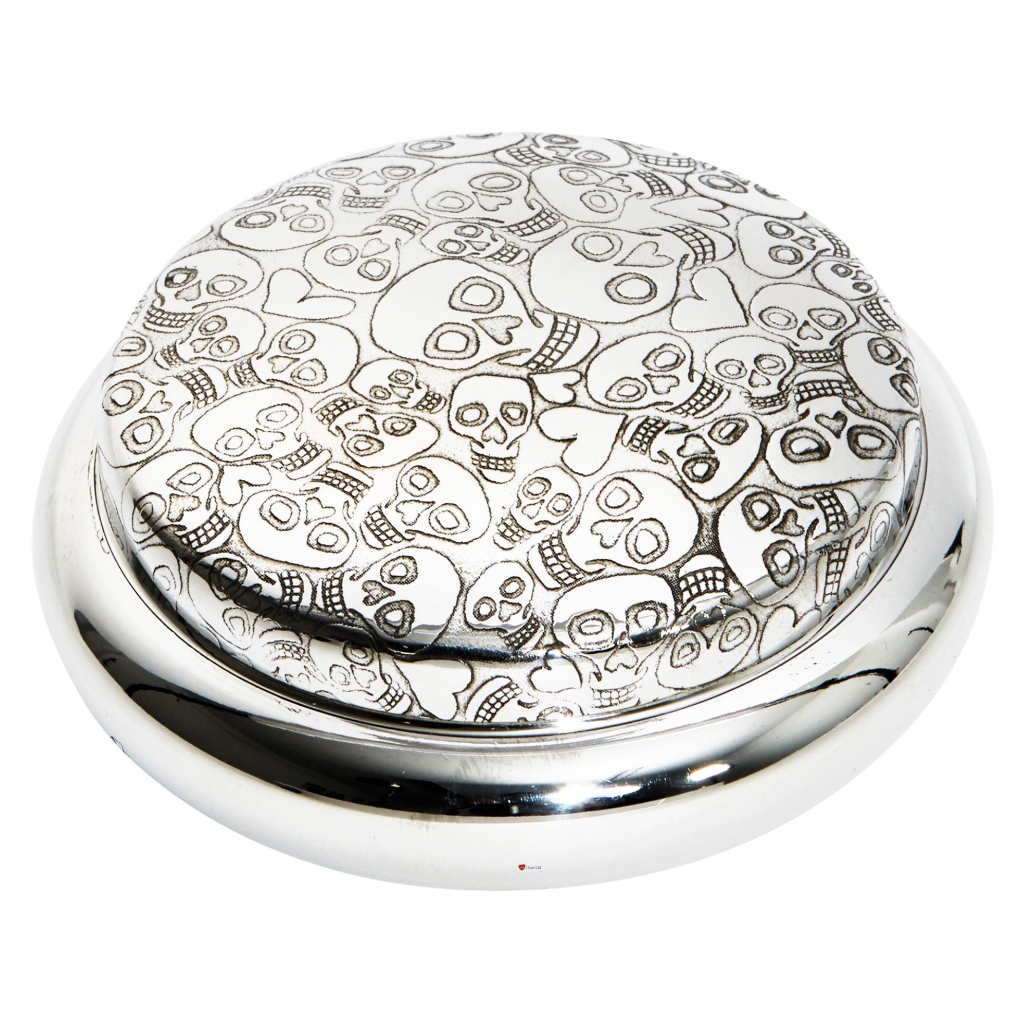 Silver round object with skull design on a white background