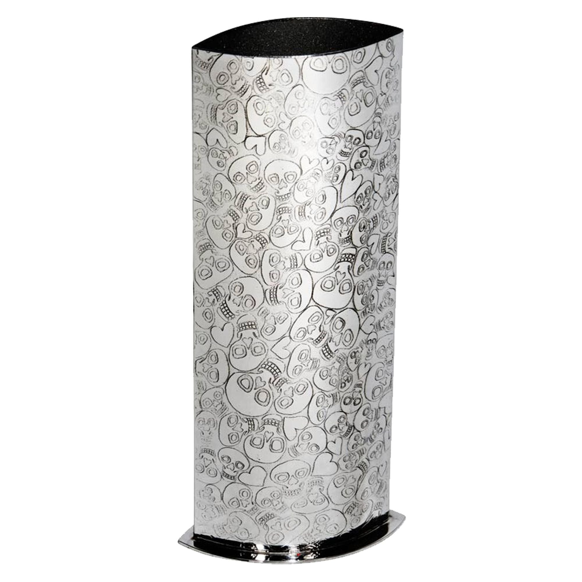 Cylindrical umbrella stand with skull pattern on a white background