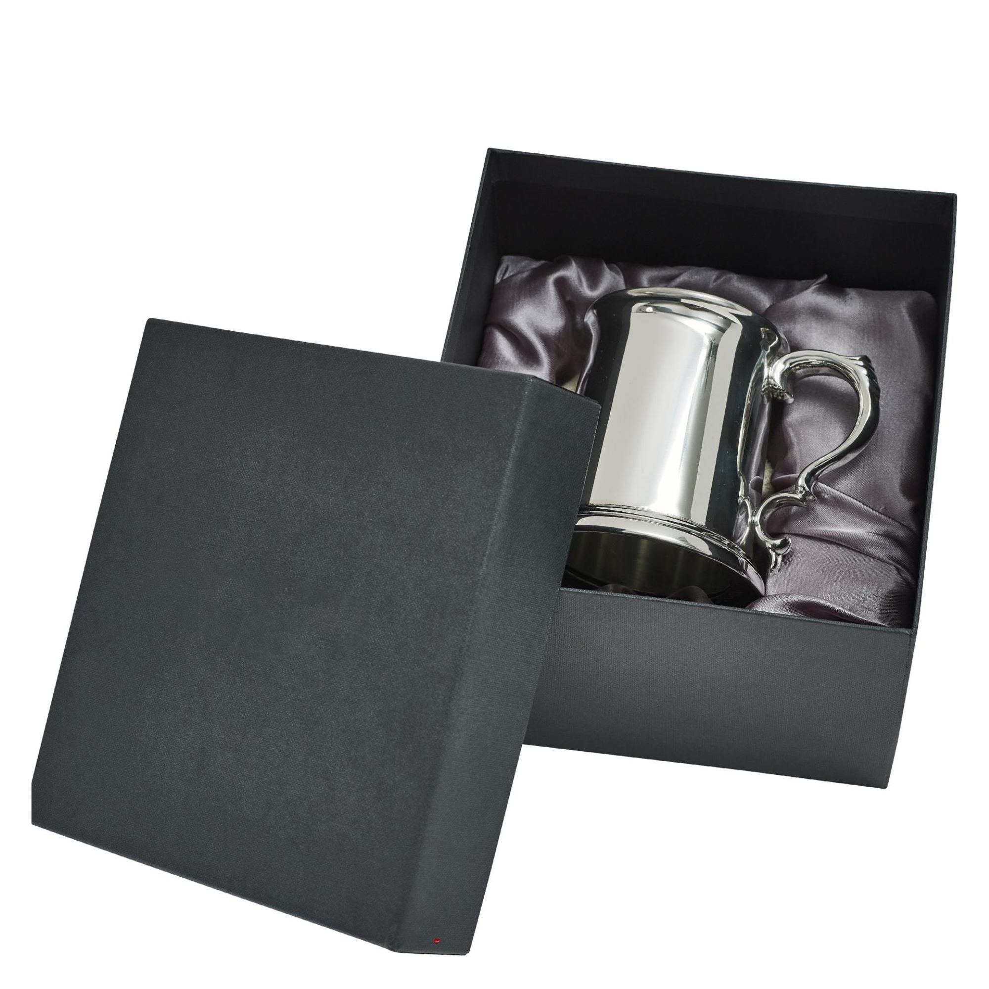 Silver tankard in a black gift box on a white background
