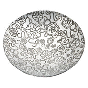 Decorative plate with black floral and abstract patterns on a white background