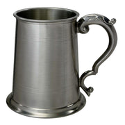 Silver tankard with a decorative handle on a white background